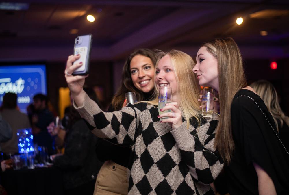 Three students talking a selfie.